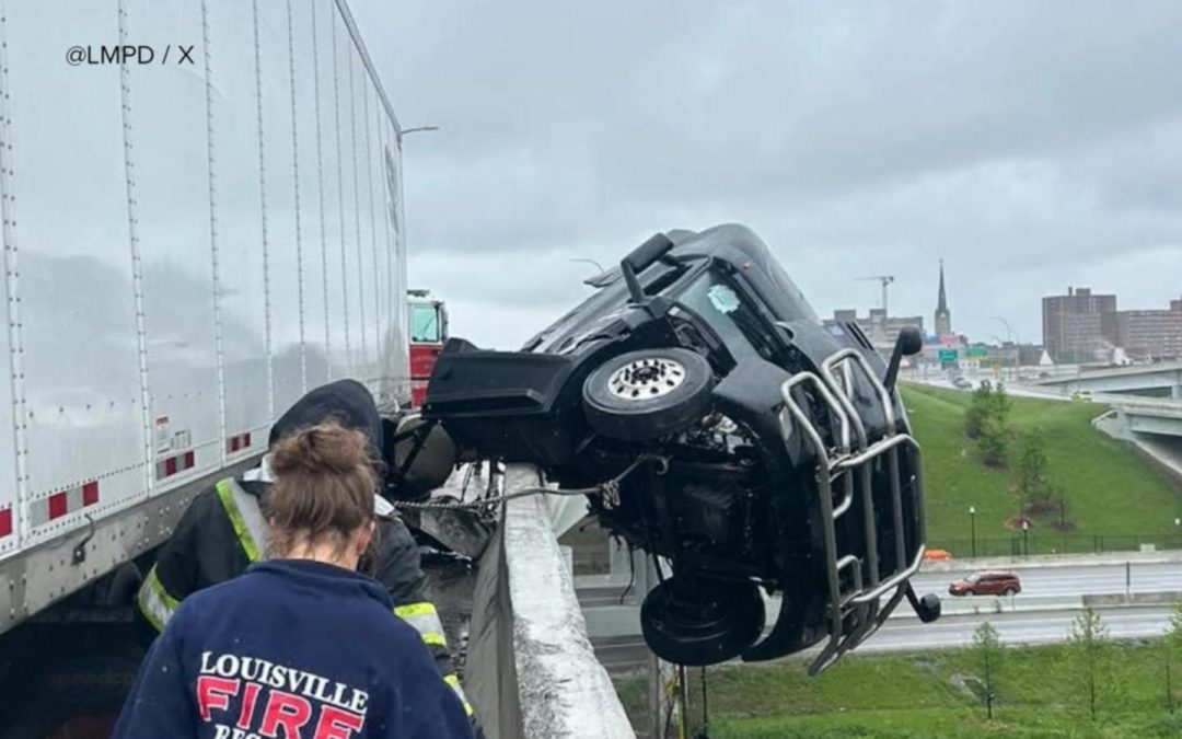 WATCH: Louisville crash leads to dramatic rescue of a semi truck driver dangling off bridge