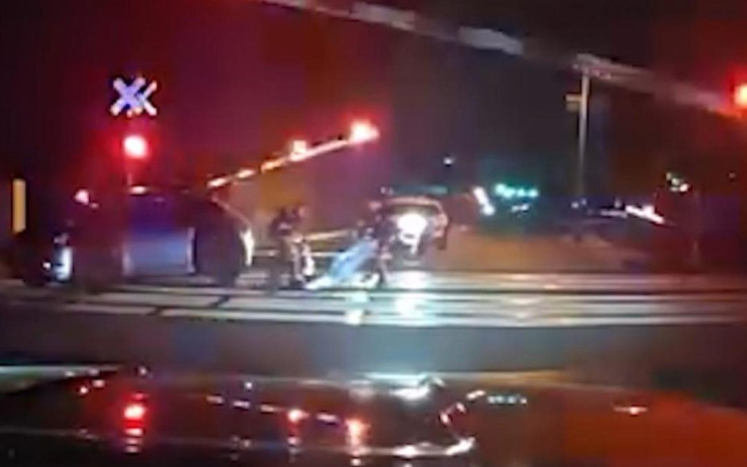 WATCH: Impaired driver pulled from car seconds before train crash