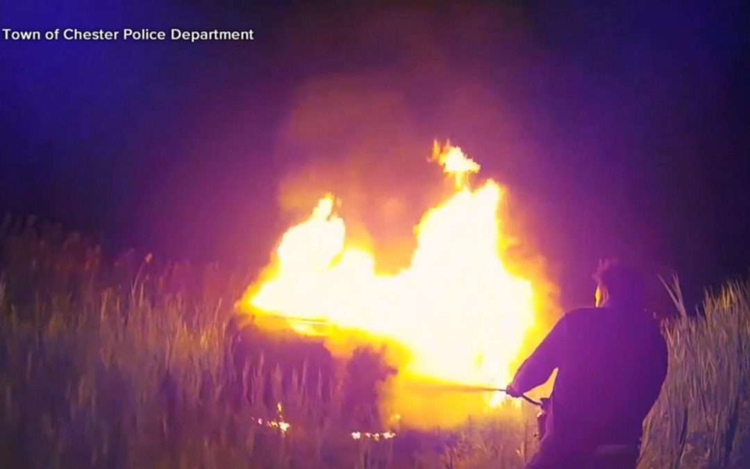 WATCH: Good Samaritan and officers save woman from burning car