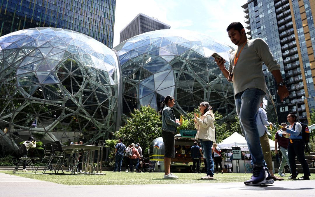 Amazon laying off about 14,000 corporate workers as it invests more in AI