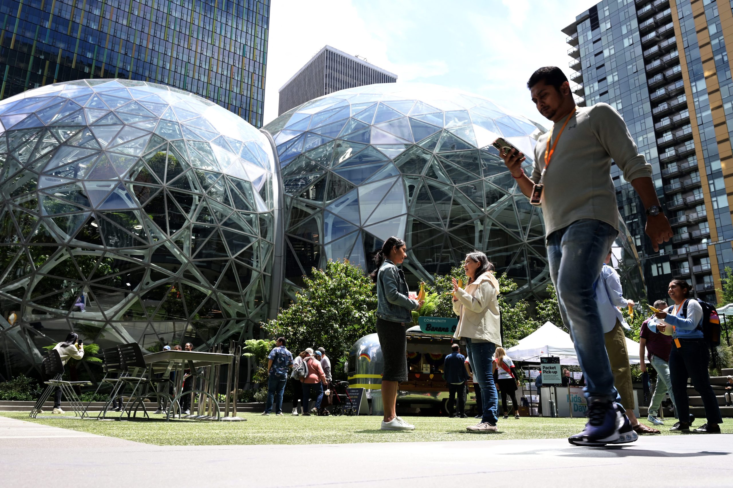 Amazon laying off about 14,000 corporate workers as it invests more in AI