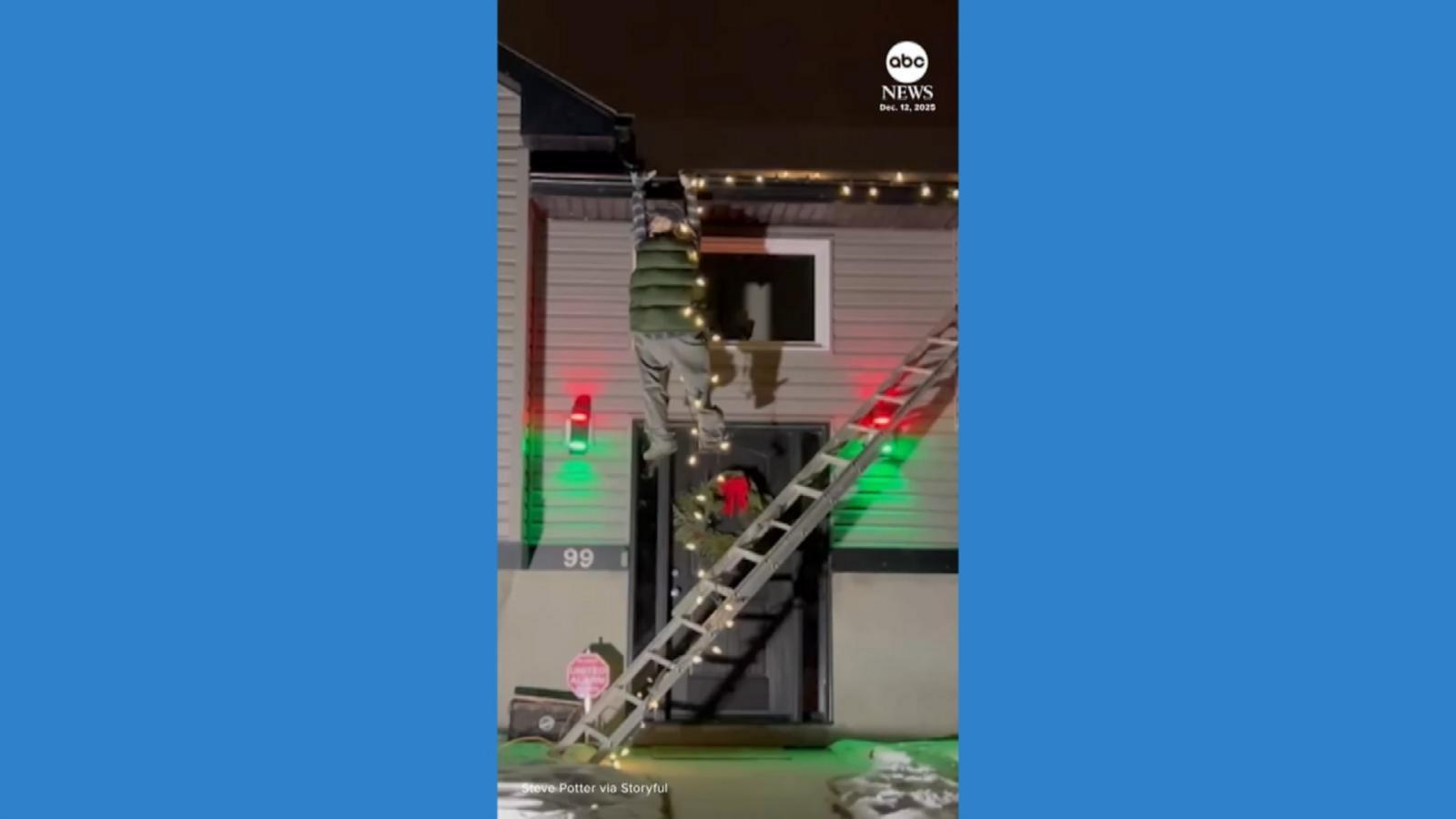 WATCH: Concerned neighbors check on robotic Clark Griswold hanging from gutter